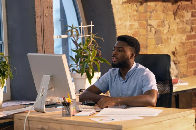 A Young man working on a computer